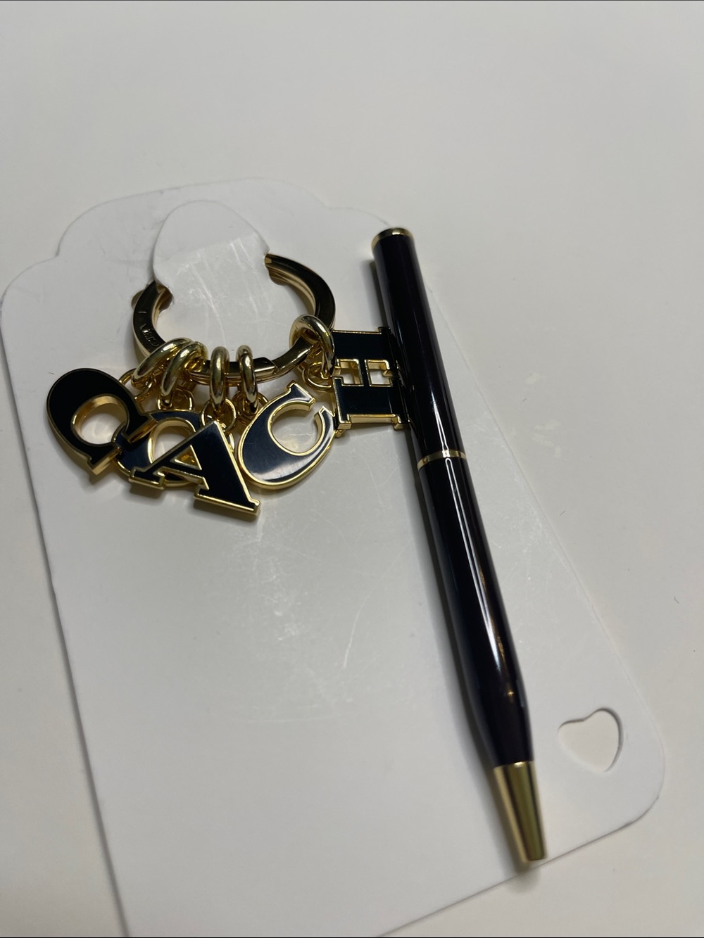 (2) COACH Black and Gold Charm Keyring and (2) hot pink Coach Pens - Picture 7 of 8
